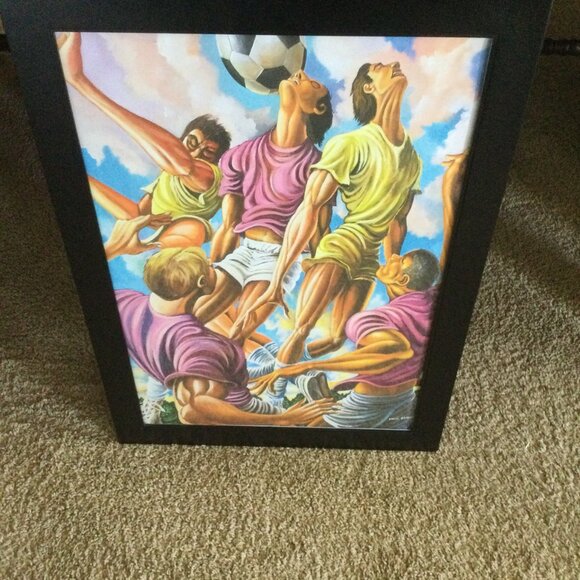 this is a canvas of effort football in a 20x30 black frame - Picture 2 of 8